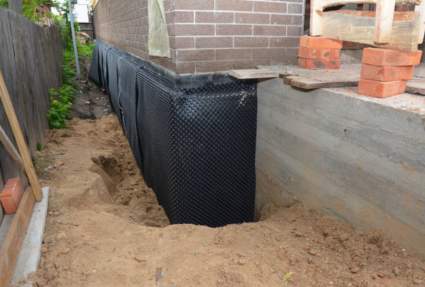 Happy homeowners after waterproofing job in River Rouge